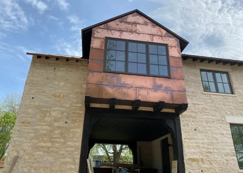 Copper metal panel facade on a stone building for Metal Roof Coating in Wooster